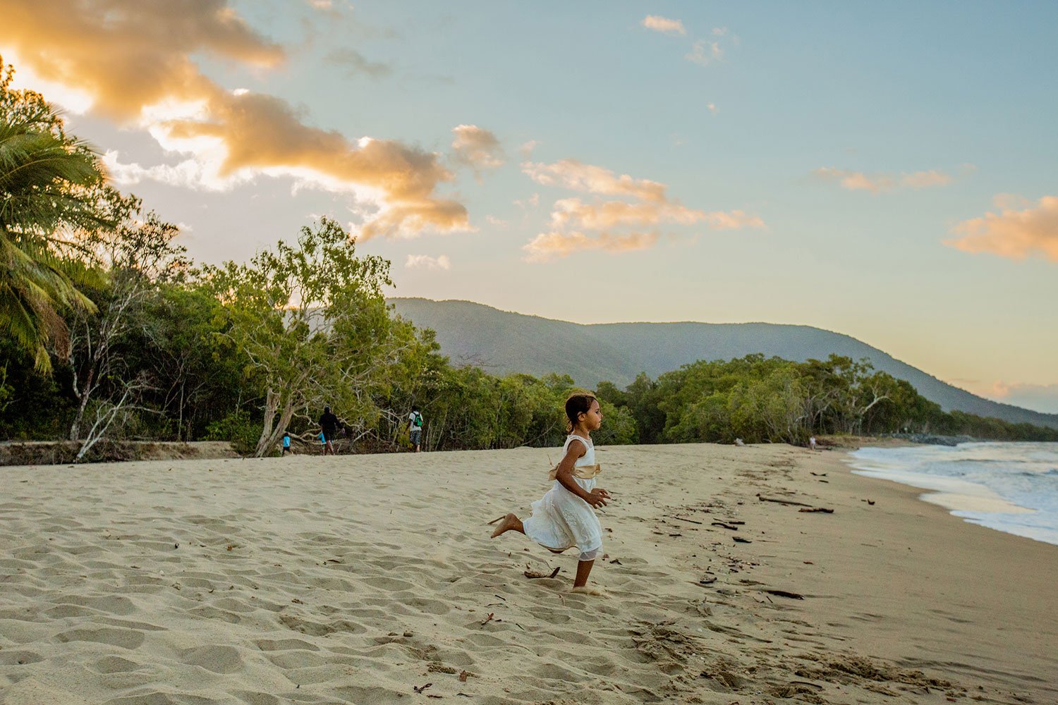child running along kewarra beach