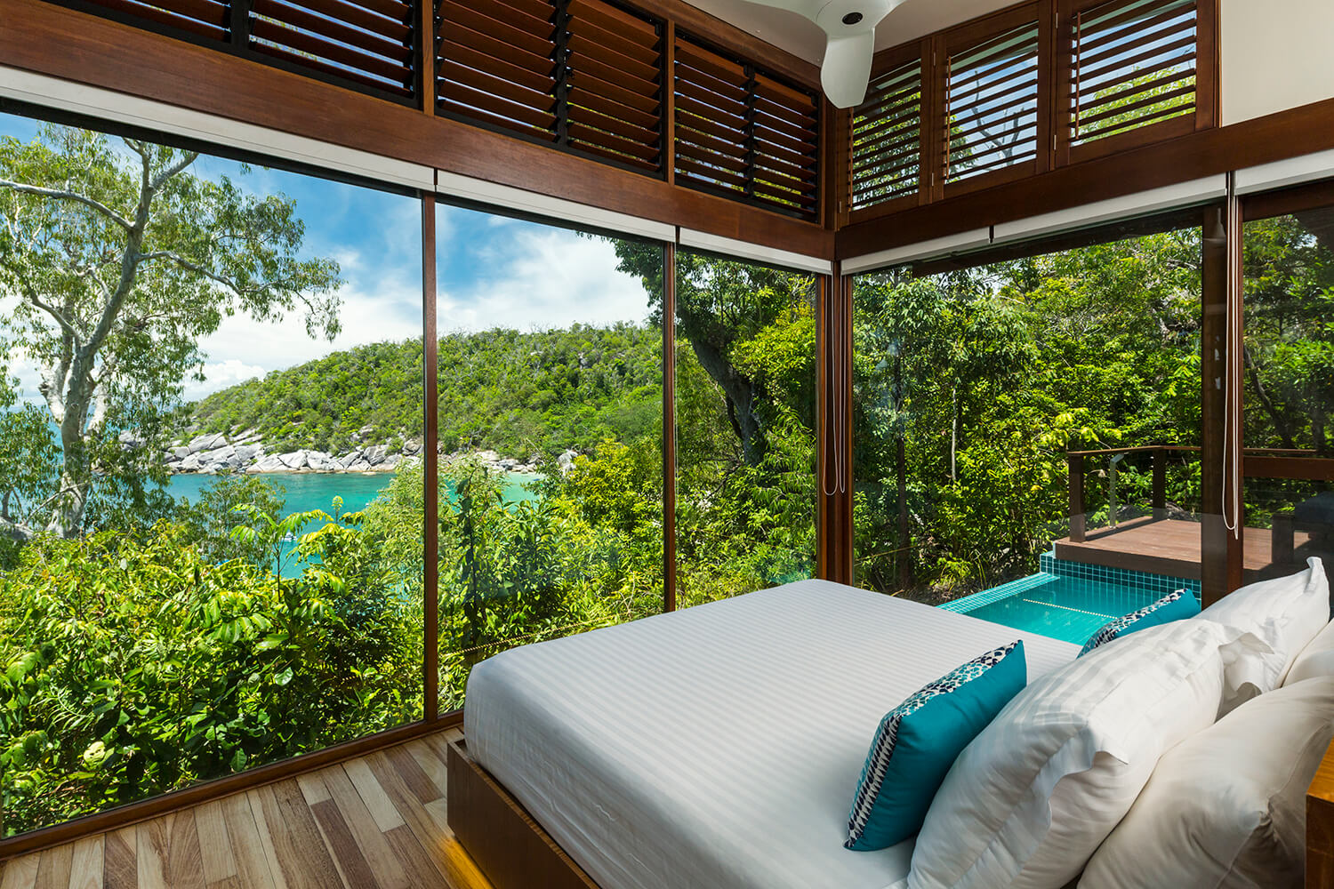 Treehouse room at Bedarra Island Resort with ocean and rainforest in the background
