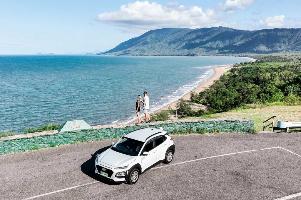couple with car at Rex Lookout on the Great Barrier Reef Drive